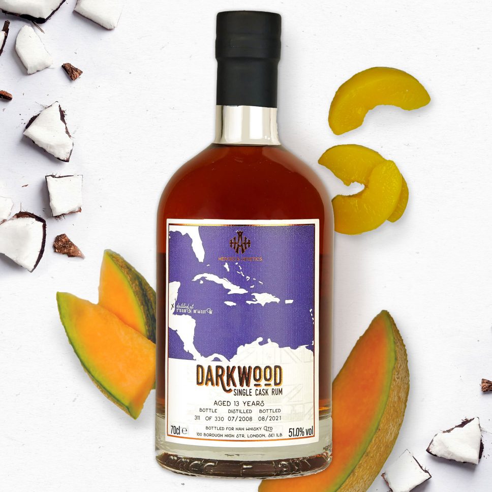 A Bottle of Darkwood Single Cask Rum with Fruit in the Background